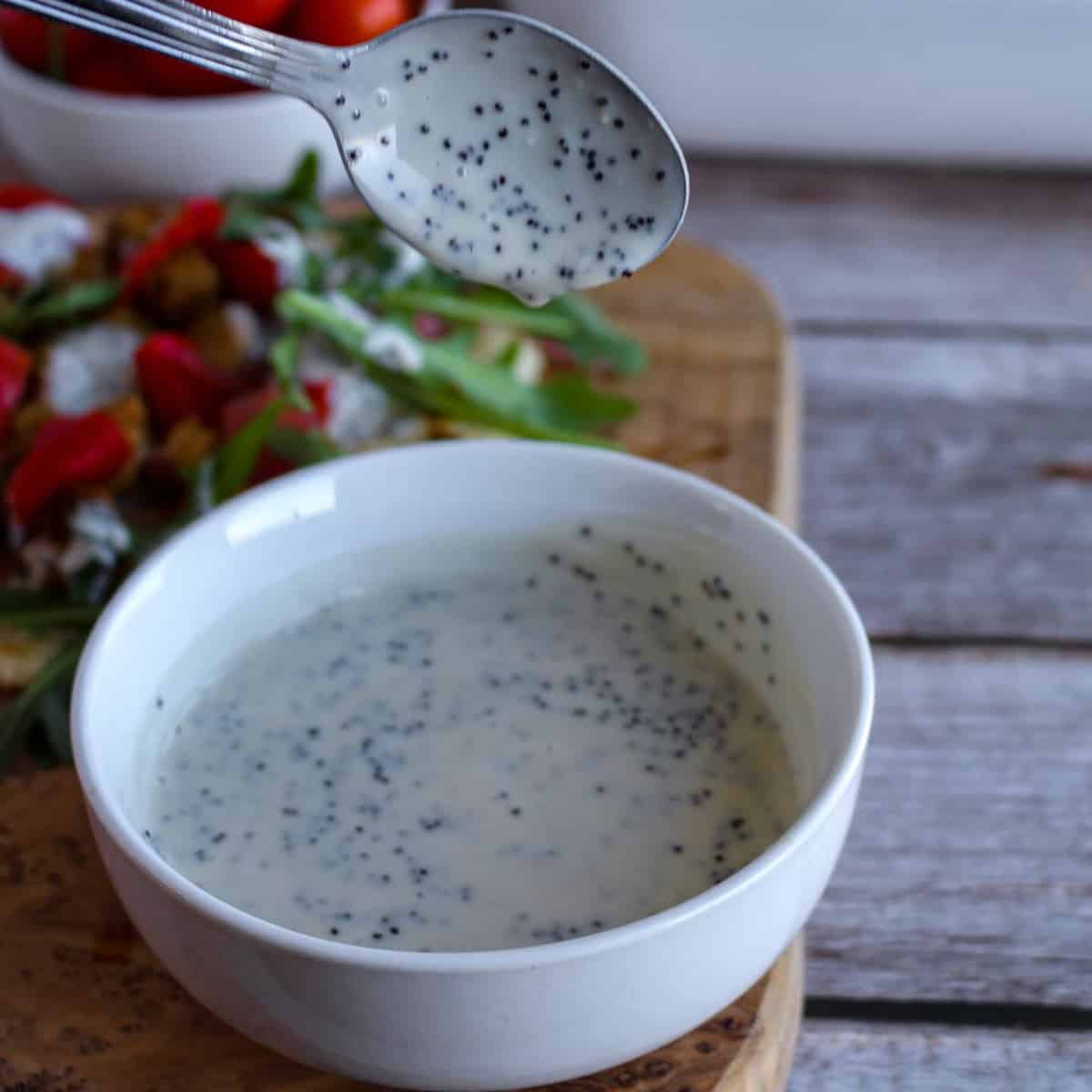 Creamy Vegan Poppy Seed Dressing in a bowl.