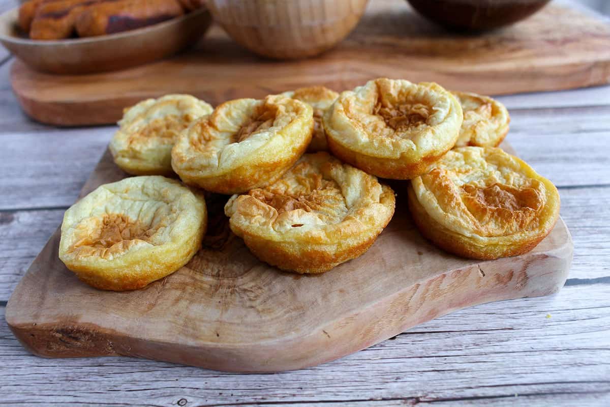 Gluten-Free Vegan Yorkshire Puddings on a board.