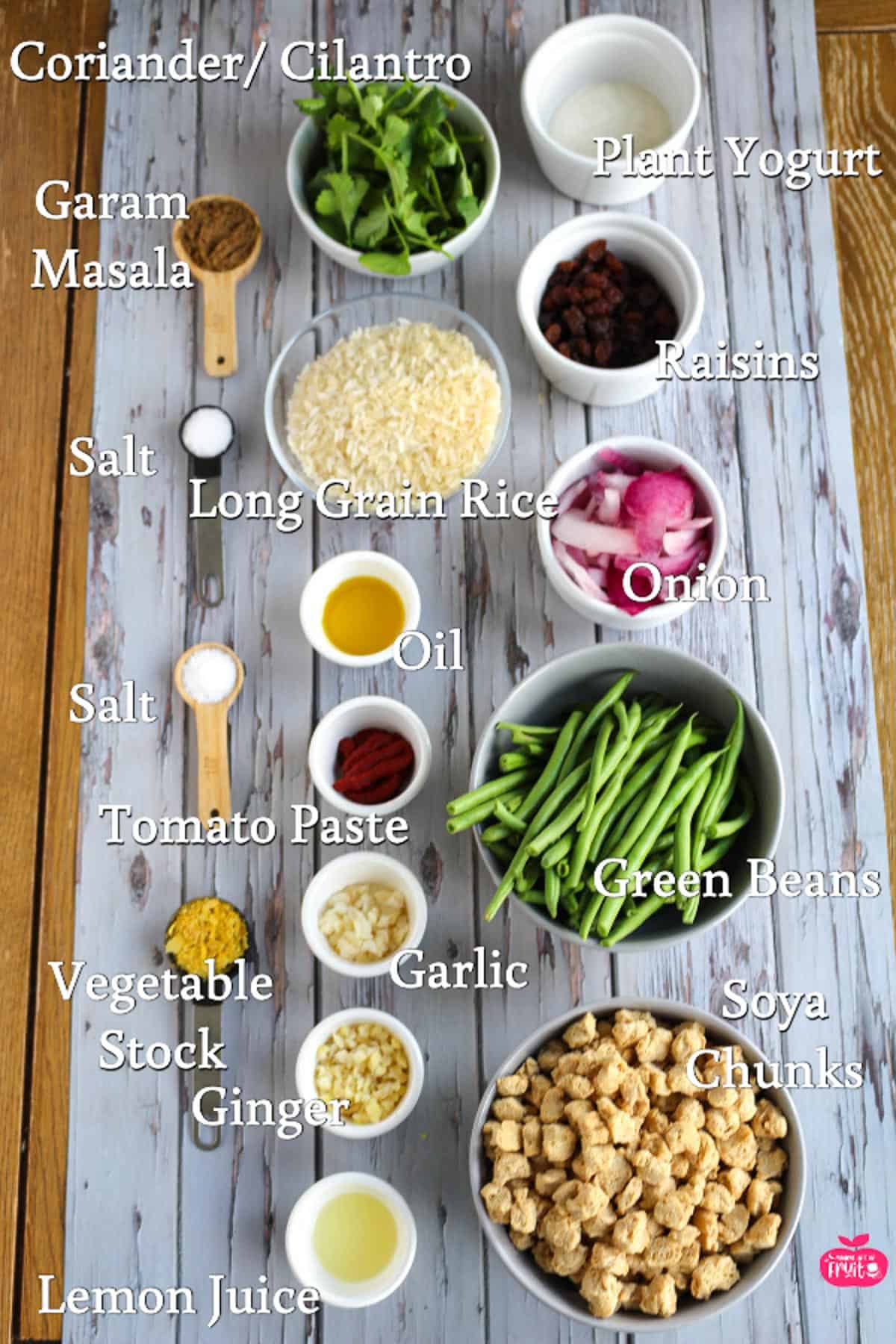 Ingredients for Speedy Soya Chunks Biryani, Coriander, plant yogurt, raisins, onion, green beans, soya chunks, lemon juice, ginger, vegetable stock, garlic, tomato paste, salt, oil, long grain rice, garam masala.