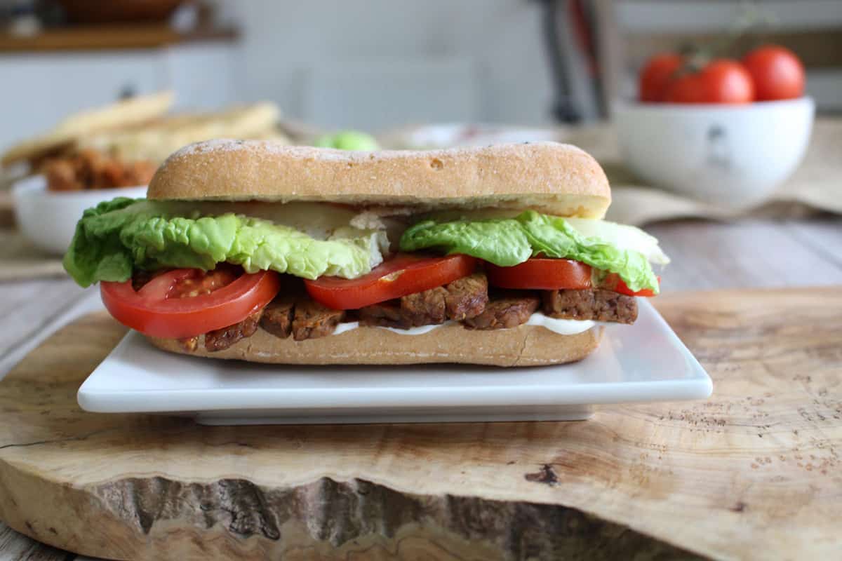 Smoked Vegan Tempeh BLT Bacon Sandwich on a plate.