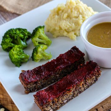 The Ultimate Vegan Meatloaf With Gravy and broccoli.