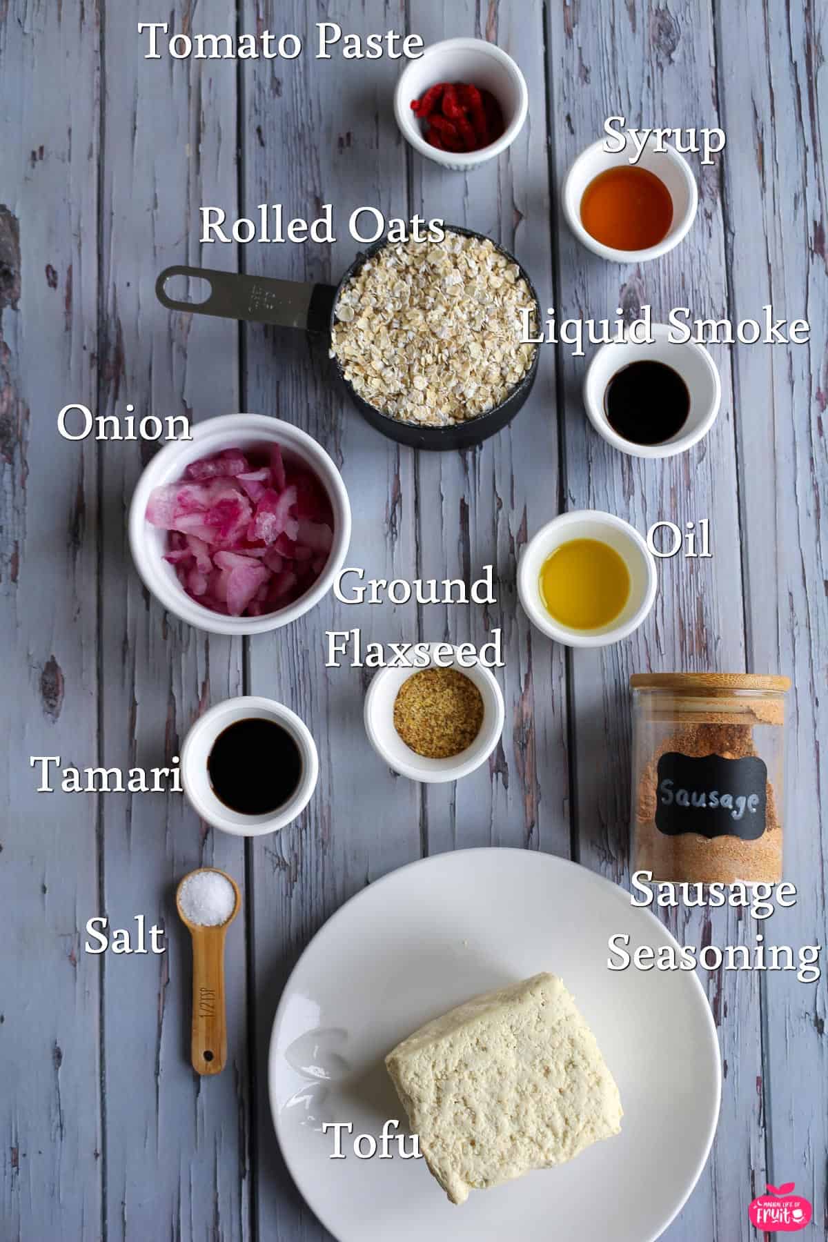 Tofu Sausage Ingredients, tomato paste, syrup, liquid smoke, oil, sausage seasoning, tofu, salt, tamari, ground flaxseed, onion, rolled oats.
