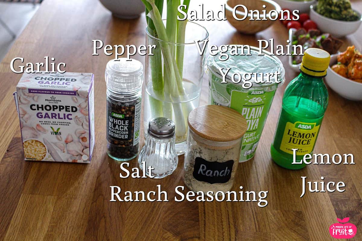 Ingredients for Vegan Ranch Dip, garlic, pepper, salad onions, vegan plain yogurt, lemon juice, salt, ranch seasoning.
